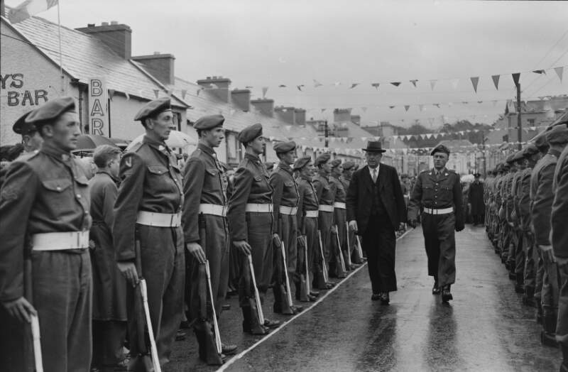 [Doctor James Ryan walking through guard of honour, at the Tidy Towns plaque unveiling, Glenties, Co. Donegal]