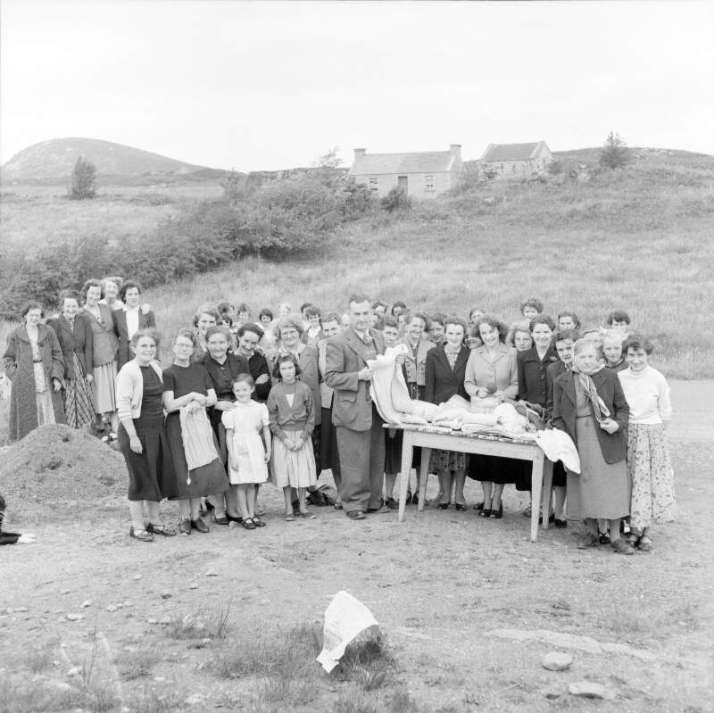 [Group of women behind table, outdoors in Lettermacaward, Co. Donegal]