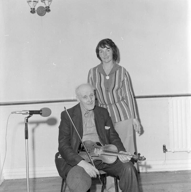 [John Doherty playing the fiddle in function room, Co. Donegal]