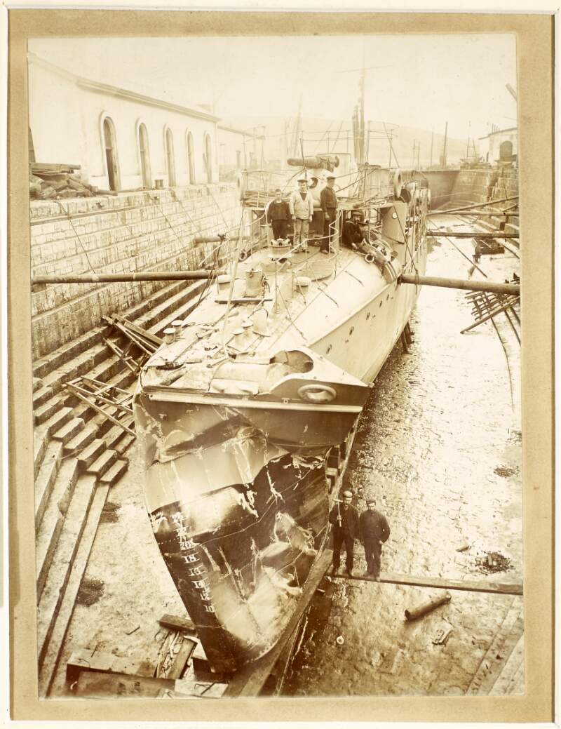 [Damaged British Navy torpedo boat with crew on deck in dry dock, Co. Cork]