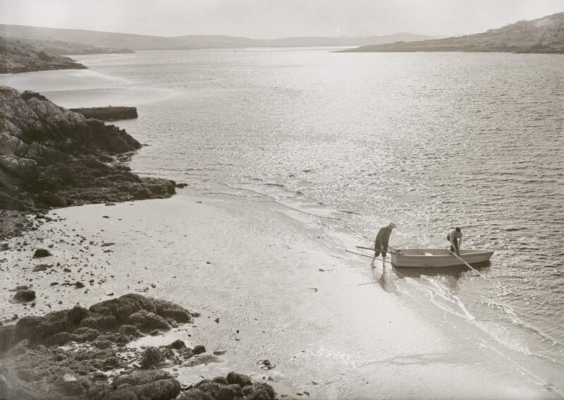 [Men on fishing boat near coast, Co. Donegal]