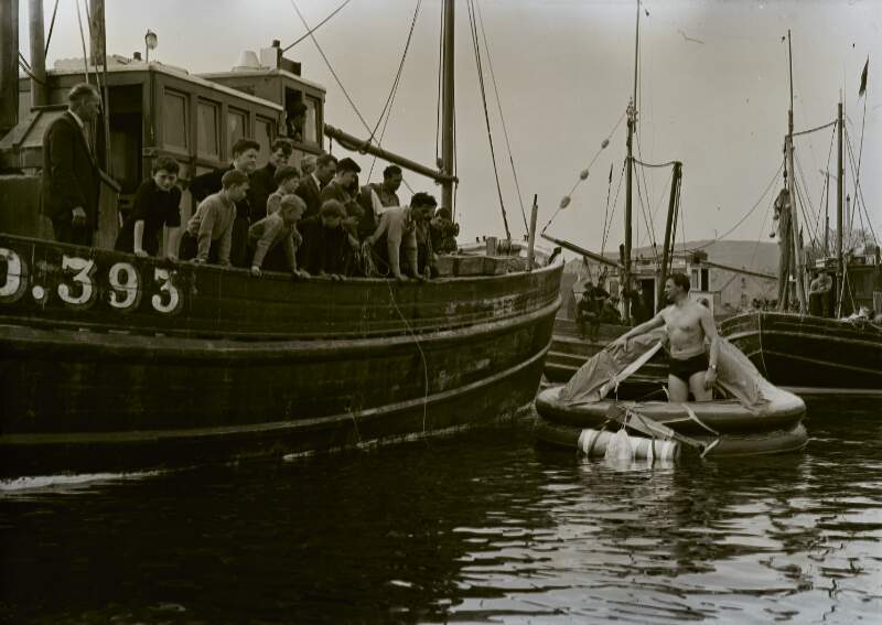 [Fishing boats and inflatable lifeboat in harbour, Co. Donegal]