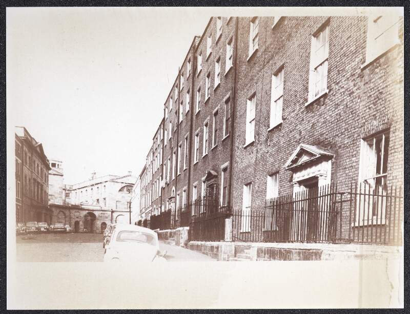 [Front of buildings on Henrietta Street, with King's Inns at the end of the street]