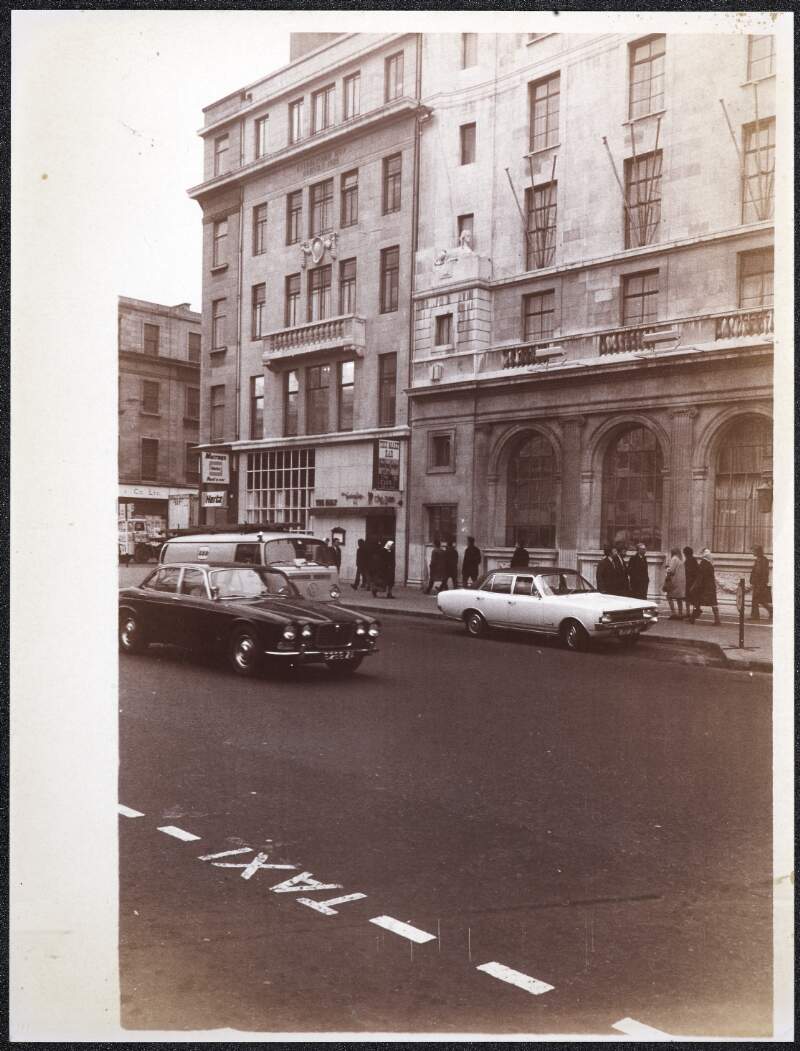 [Part of the Gresham Hotel and Mueeay's Rent A Car, on Upper O'Connell Street by the Cathal Brugha Street junction]