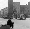[Man seated near Parnell Monument, Upper O'Connell Street, Dublin]