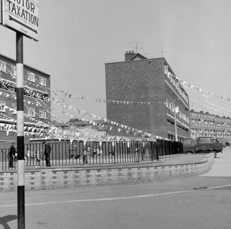 [Block of flats decorated with bunting, Corpus Christi feast-day, Coleraine Street, Dublin]