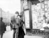 [Man and woman standing outside Sibley's Stationery Shop, Grafton Street]