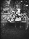 [Children, Ethel and Edith Dillon, seated on a garden bench, Clonbrock House]