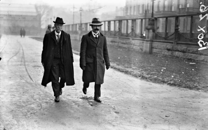 [Two men arriving for Treaty ratification meeting at U.C.D., Earlsfort Terrace]