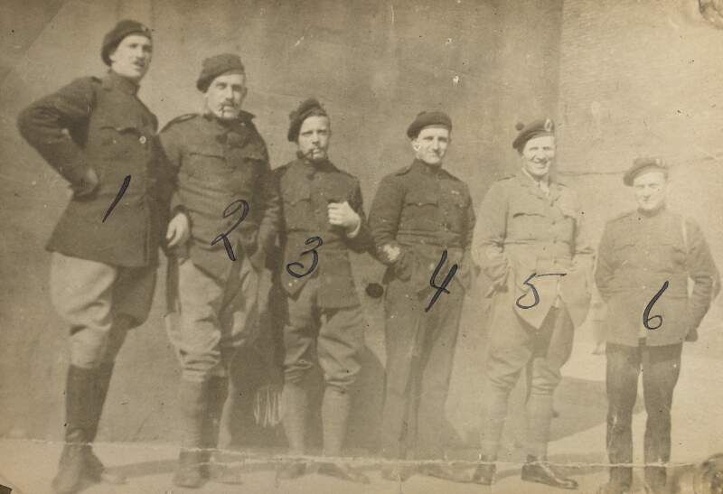 [Six members of the Auxiliaries 'F' Company, photographed in uniform]