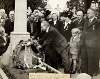 [Piaras Béaslaí laying a wreath on Michael Collin's grave in Glasnevin Cemetery, at a commemorative service for Collins and Arthur Griffith]