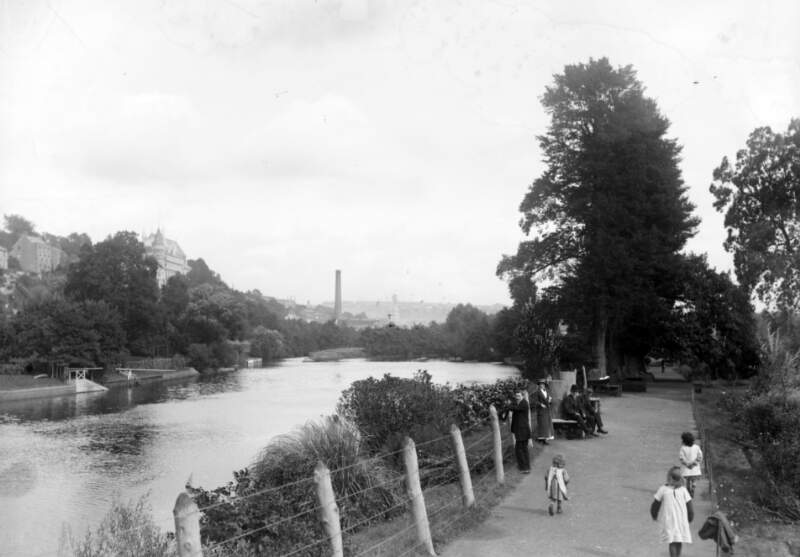 [Pedestrians along by the River Lee, in the Mardyke, Cork city]