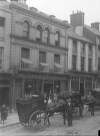 [Shops, pedestrians and delivery carts on Shandon Street, Cork]