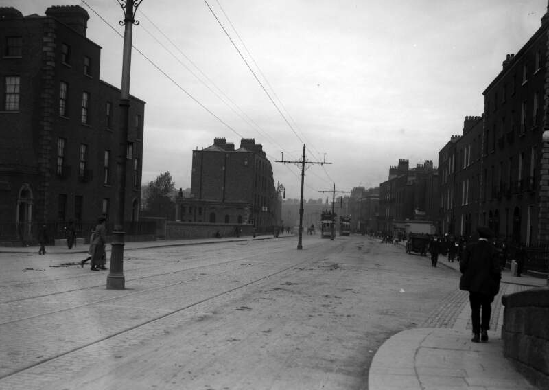 [Pedestrians, motor cars and trams on Baggot Street, Dublin]