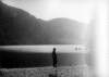 [Boy standing by the lake's edge in Glendalough, Co. Wicklow]
