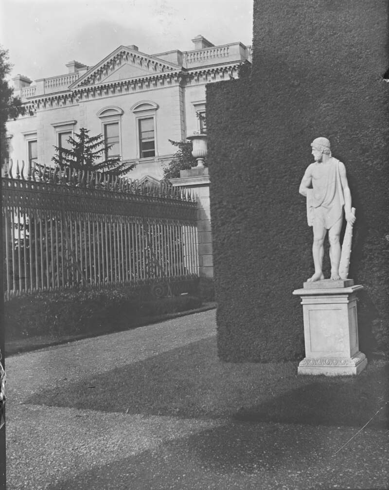 [St Annes. View of St. Annes Clontarf, Co. Dublin. Grecian statue in foreground. Home of Ardilaun, also shows railings and pine trees.]