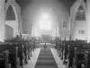[Chapel, interior 1926. Interior of chapel showing altar viewed from centre aisle. Tiles in centre of aisle. St Catherine's church was damaged in 1922 and was repaired and reopened in 1926.]