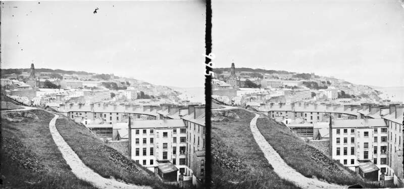 A view of the town of Cobh, looking eastwards below the cresent, promenade, sea-front, high angle view over town, Co. Cork