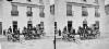 Clifden car office, long outside car (with passengers but no horse) and small cart in foreground, Galway City, Co. Galway