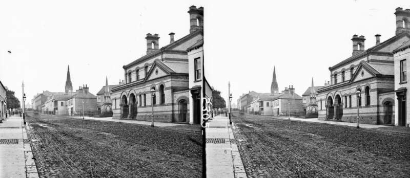 Mechanic's Institute: Junction of Charles Street with street centre memorial fountain, in background, octagonal spire with clock in far background, Lurgan, Co. Armagh