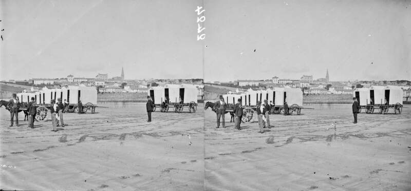 Beach with people, two-wheeled bathing machines, and a horse & cart, Tramore, Co. Waterford