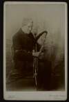 Photograph of Martin Reilly, the Galway piper, playing a set of pipes,