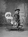 Two children in toy pony and trap : commissioned by Mrs. Nolan, Tenor, Tramore