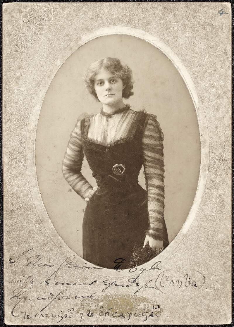 [Maud Gonne, three-quarter length oval portrait, with right hand on hip, wearing black dress and celtic brooch]