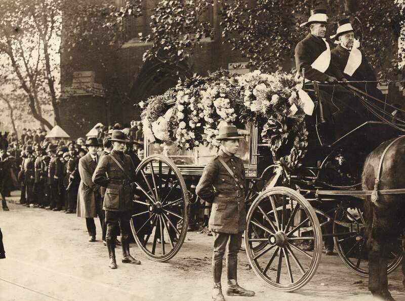 The Late Lord Mayor of Cork : The coffin covered with flowers and guarded by Irish Volunteers in uniform