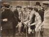 [Michael Collins greeting the Dublin hurling team with Harry Boland in the foreground]