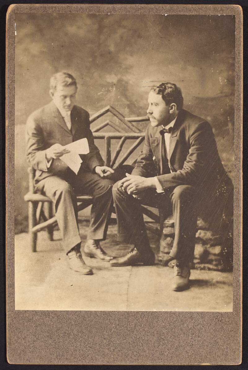 [Joseph McGarrity and an unidentified man sitting, full length]