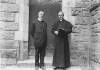 [Lusitania Disaster, Cobh, Co. Cork : two clergymen standing outside wooden door]