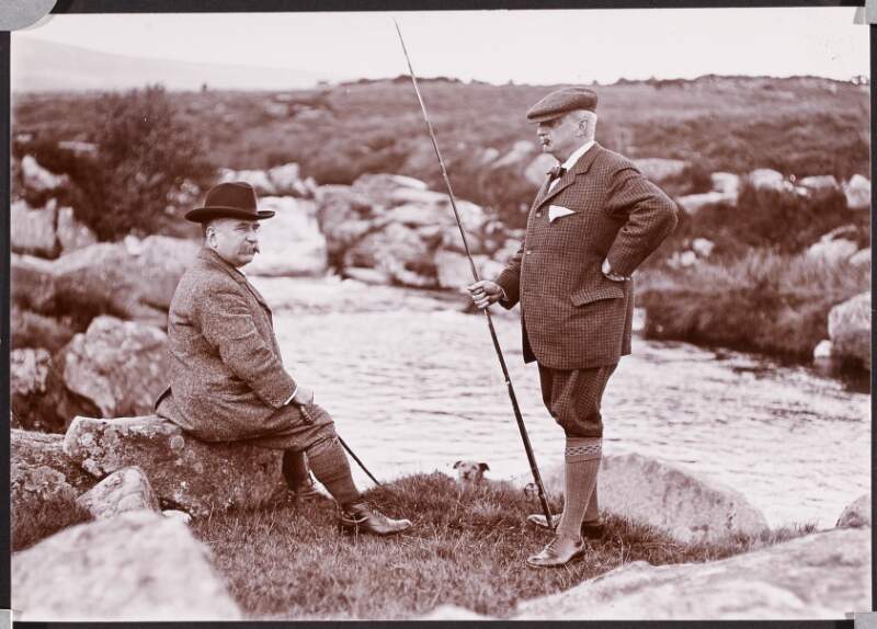 [John Redmond and William H. K. Redmond, beside river, holding fishing rods]