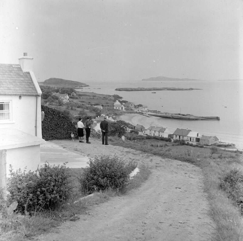 [Woman and men outside house, Arranmore, Co. Donegal]