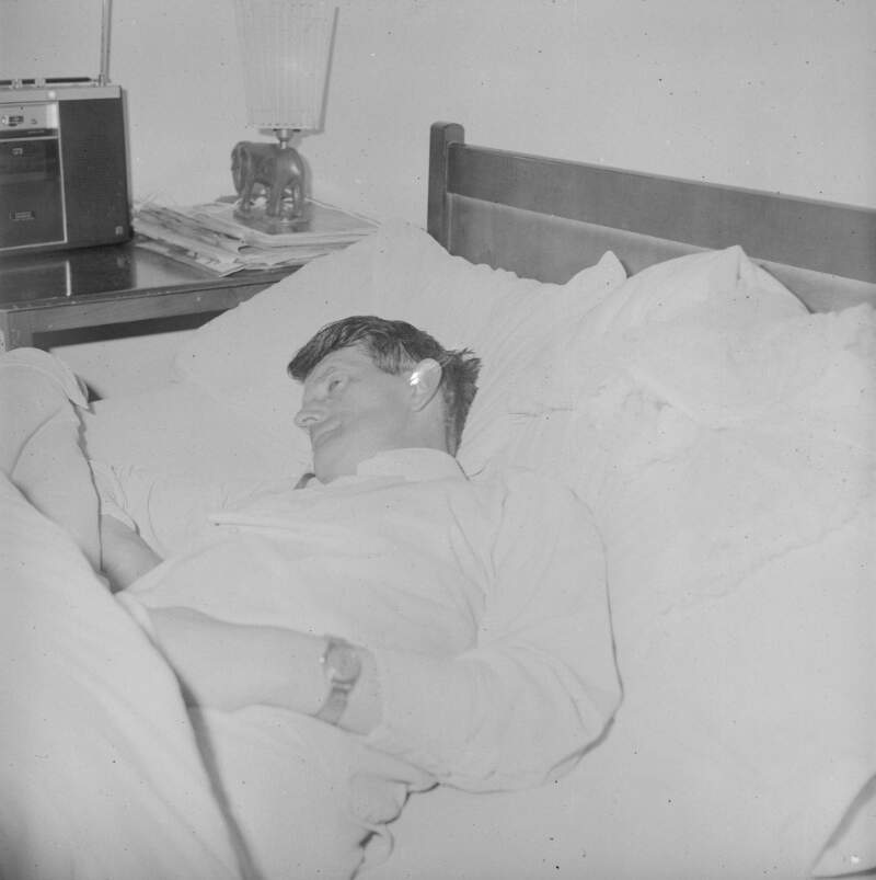 [Man lying on bed, Carrick, Co. Donegal]