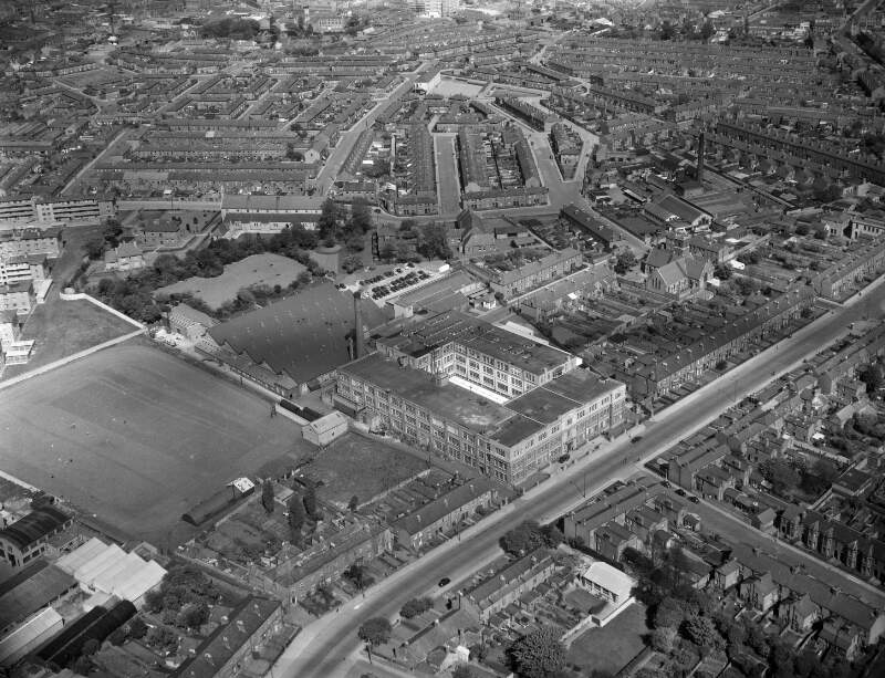 [Aerial photograph of a factory in an urban setting]