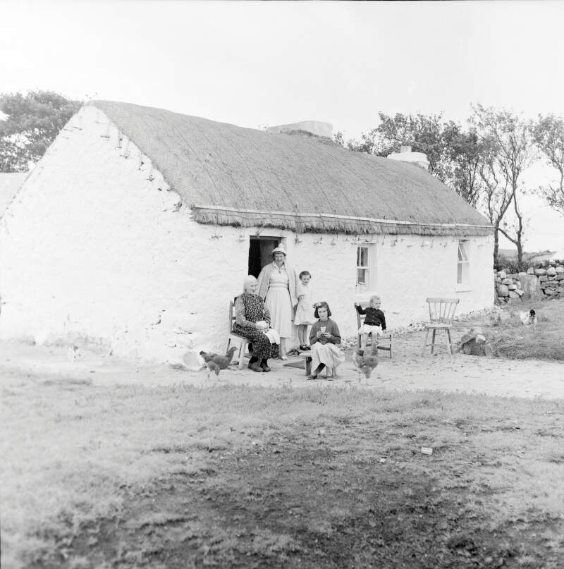 [Women knitting outside cottage, Lettermacaward, Co. Donegal]
