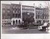 [Roches Chemist, the Dublin City Bus Services, Marlowe Cleaners and Premier Manshop, on Upper O'Connell Street]