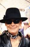 Close up of Ailbhe Smyth in black hat and sunglasses. Dublin Lesbian and Gay Pride March