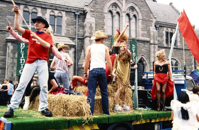 Close up of Cowboy float outside Christchurch Cathedral including Tony Walsh and Shirley Temple Bar. Dublin Lesbian and Gay Pride March