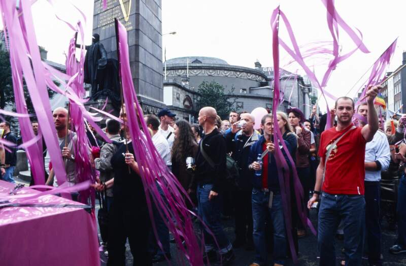 Marchers following behind pink float Dublin Lesbian and Gay Pride March