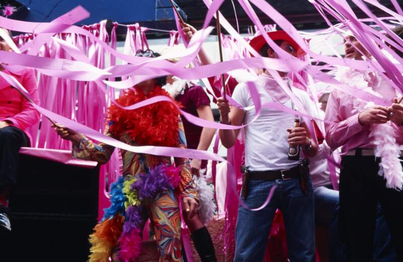 Close up of revellers on float through pink streamers Dublin Lesbian and Gay Pride March