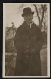[Half-length portrait of Seán T. O'Kelly standing outdoors, holding a cane]